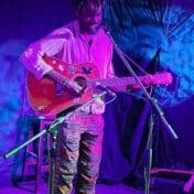 boyowa_standing-on-stage-guitar